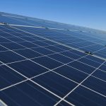 Row of solar panels on a solar farm