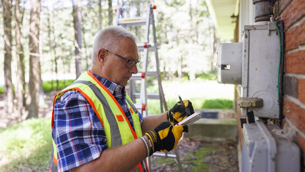 Man performing home energy audit