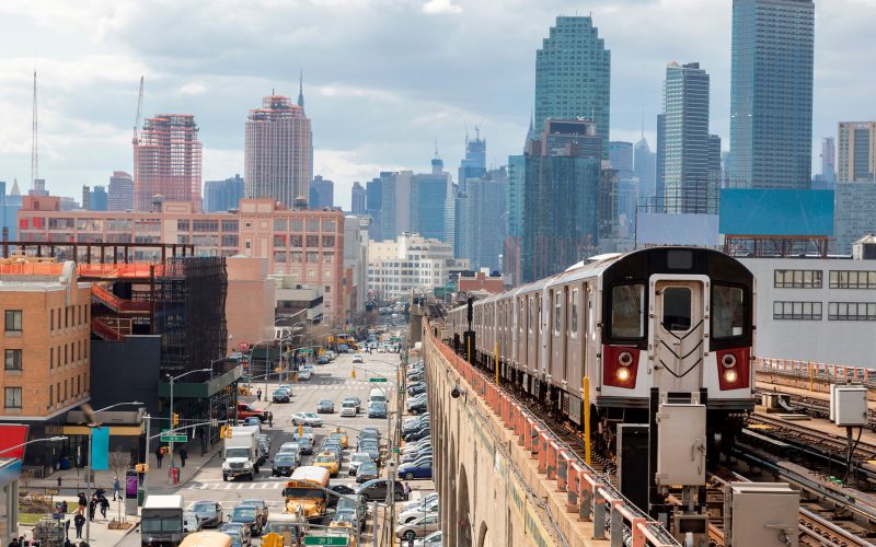 Subway Train Approaching Elevated Subway Station in Queens