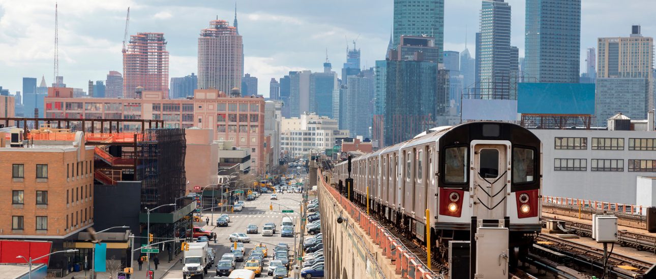 Subway Train Approaching Elevated Subway Station in Queens