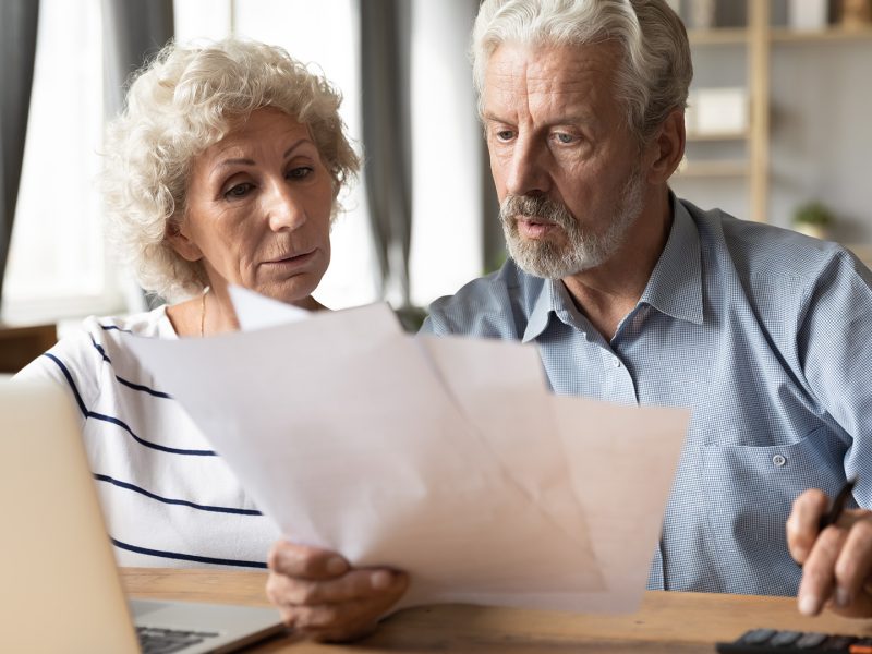 Senior citizens paying bills