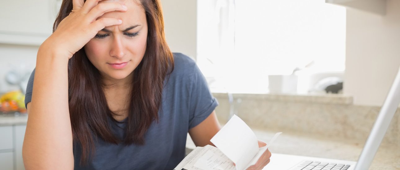 Woman looking at household bills