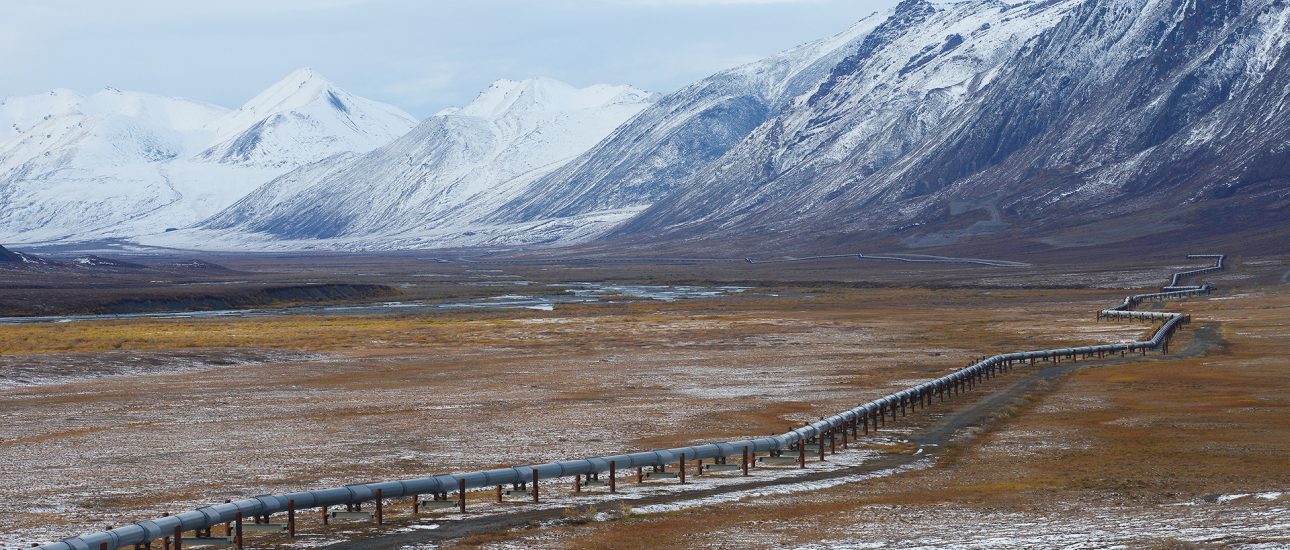 Oil pipeline in Alaska with mountain range