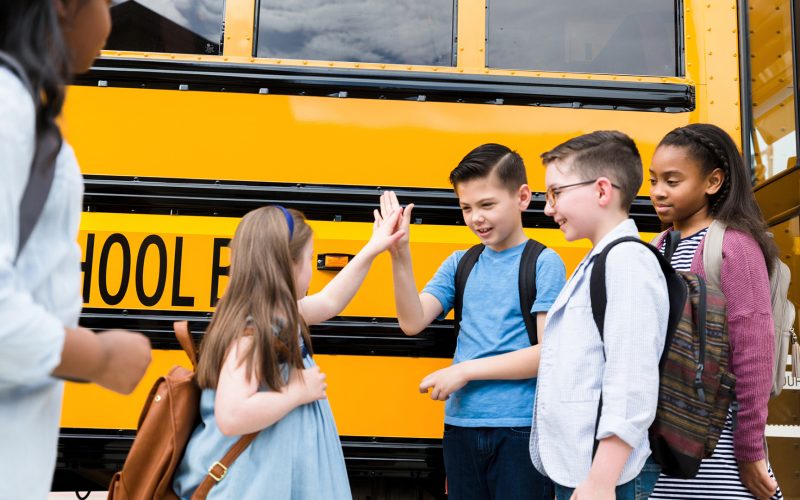 Children going back to school on a bus