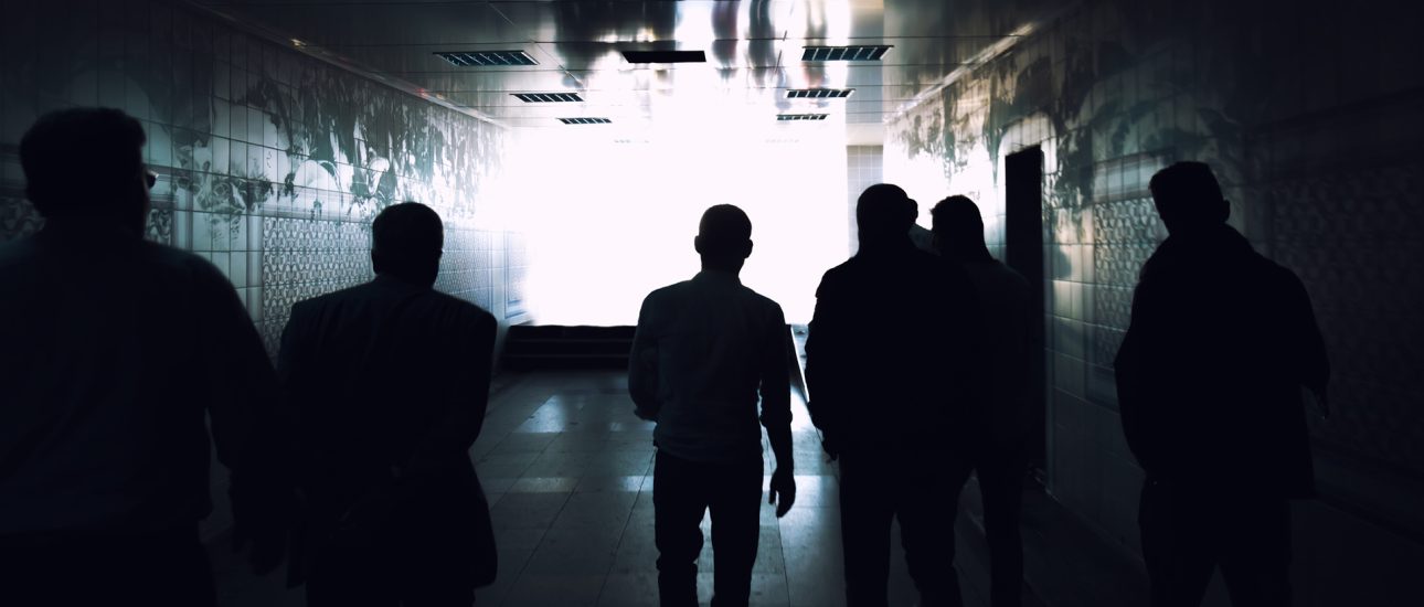 People Walking In Hallway